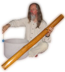 Shabdan holding a rain stick